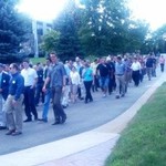 long stream of faculty making their way to lunch